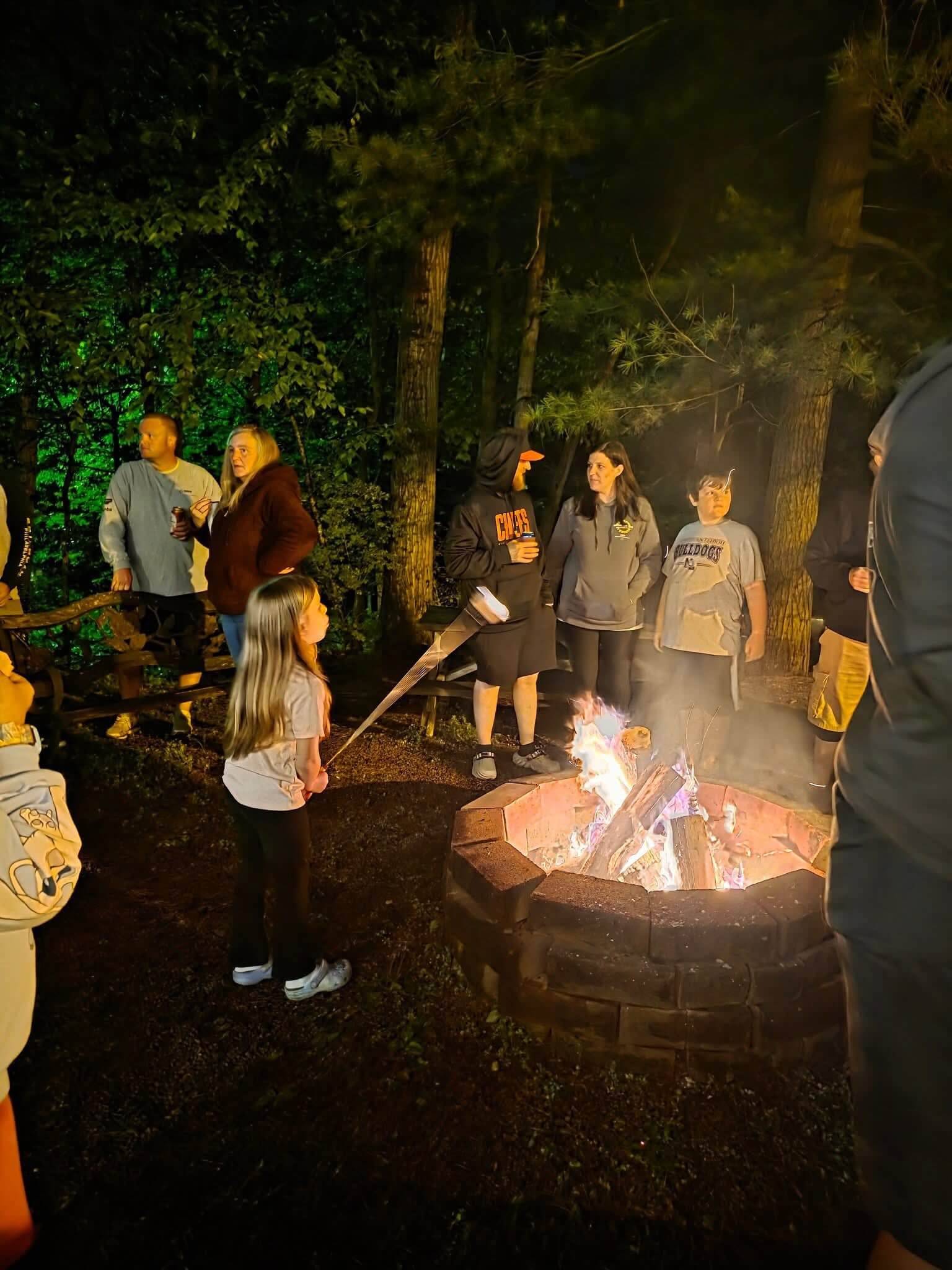 Families gathered around a campfire