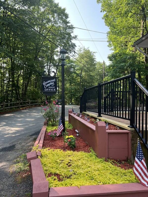 Rosemount office entrance with flower beds and flags